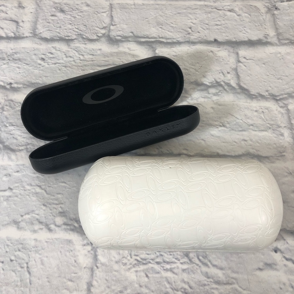 Oakley Sunglasses cases. Set of 2. White large. Black small. Preowned